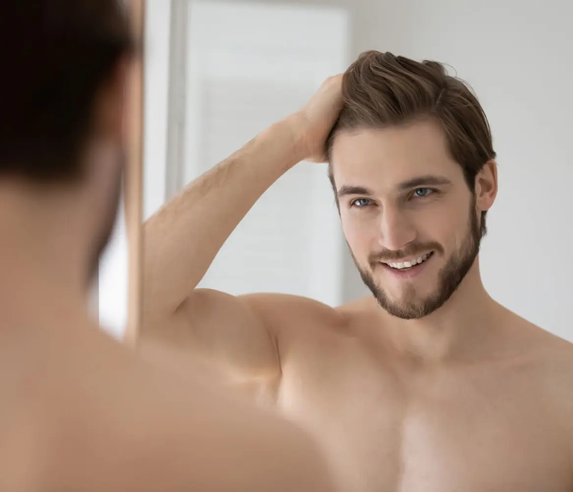 Man after receiving professional laser hair removal treatment at a medical spa, illustrating laser hair reduction for men