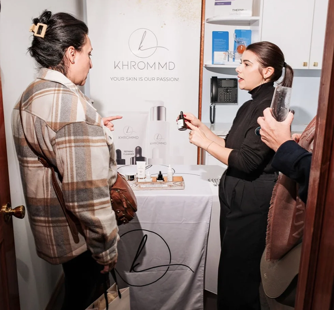 Skincare consultation at a booth